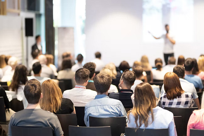 Speaker-giving-a-talk-in-conference-hall-at-business-event_-Audience-at-the-conference-hal
